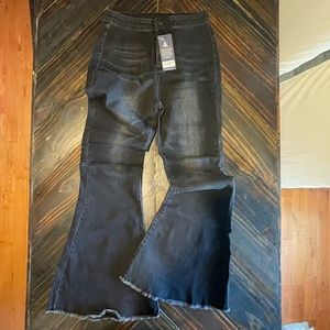 Black wash bell bottom cut off jeans